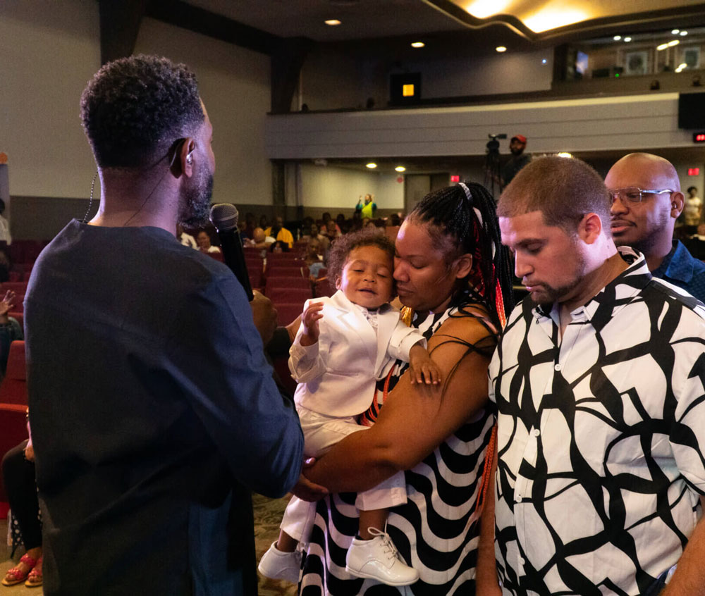 Family dedicating baby at Embassy Center MKE